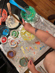 little girl decorating sugar cookies