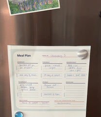 meal plan hanging on fridge