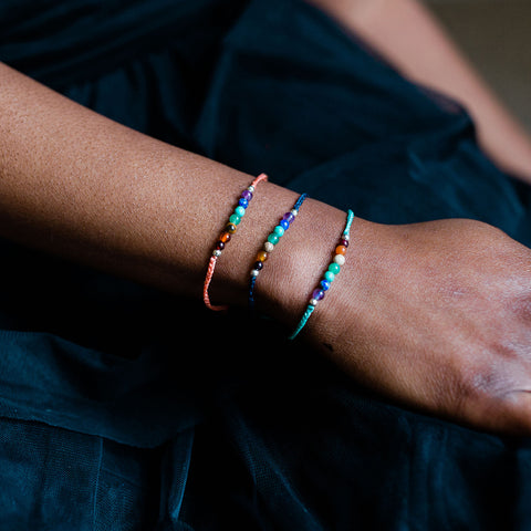 chakra bracelets on woman's arm