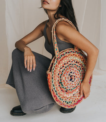 chindi woven colorful tote on model in grey dress