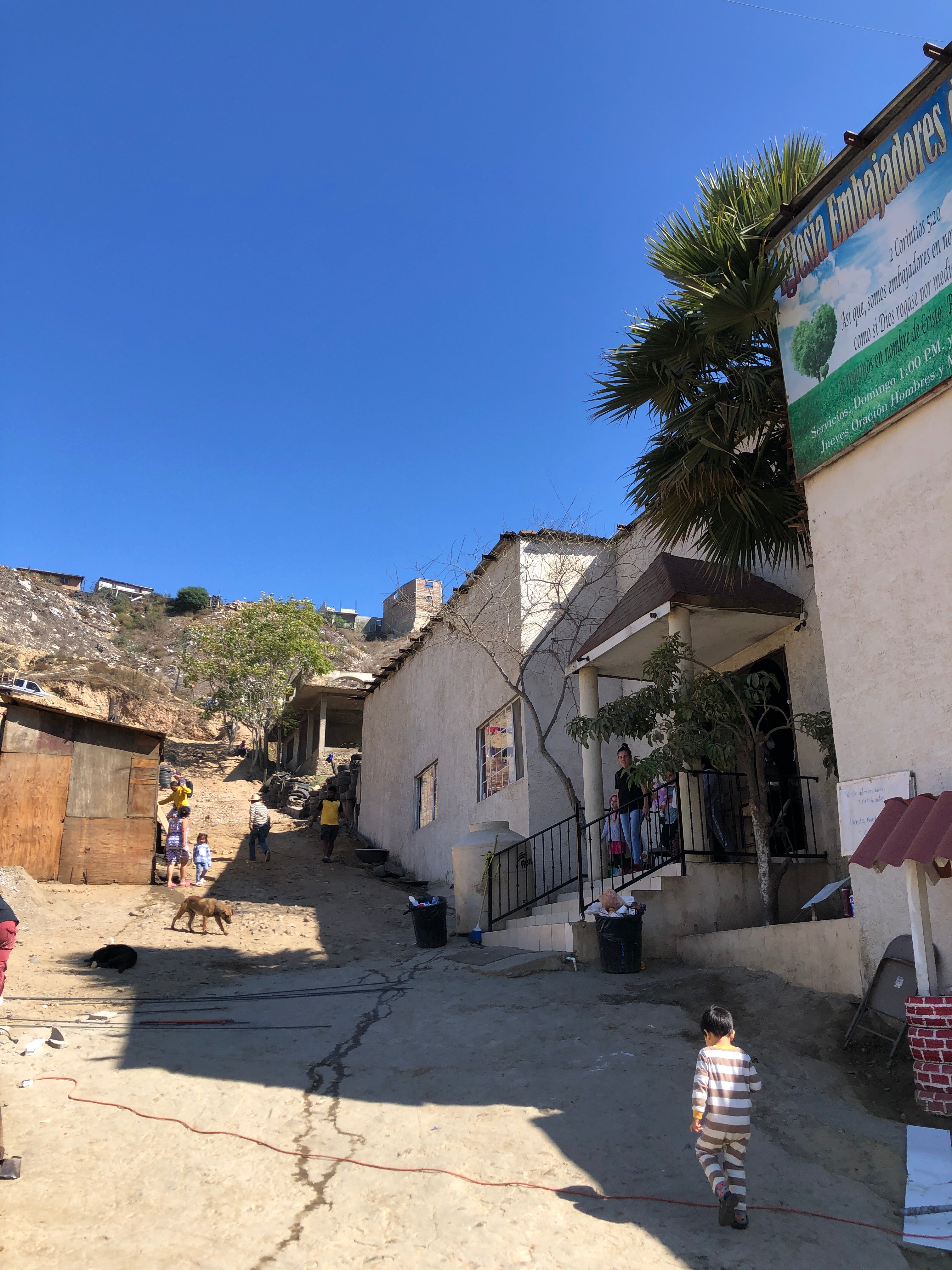 houses makeshift dirt road mexico refugee camp sanctuary do good shop partnership