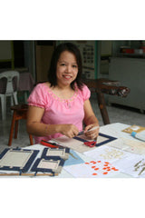artisan making ethical handmade paper photo frames in the Philippines