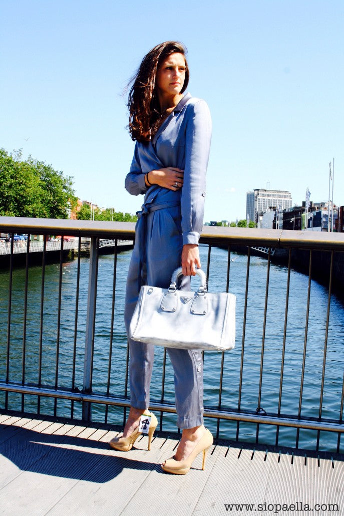 Anna wears grey Selected Femme jumpsuit in a UK size 10 (Item Code- 1161-5) styled with Prada grey stoned washed handbag. 