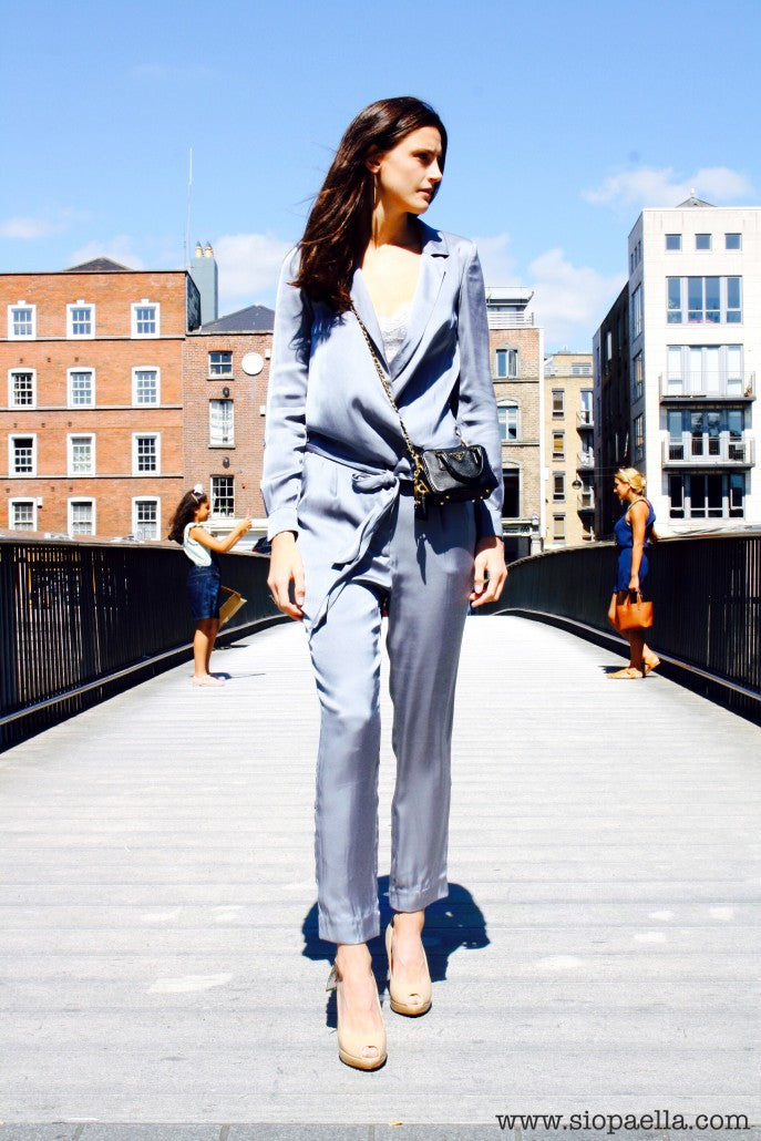 Anna wears grey Selected Femme jumpsuit in a UK size 10 (Item Code- 1161-5) styled with Prada Black Saffiano Lux Double Handle Mini Satchel. 