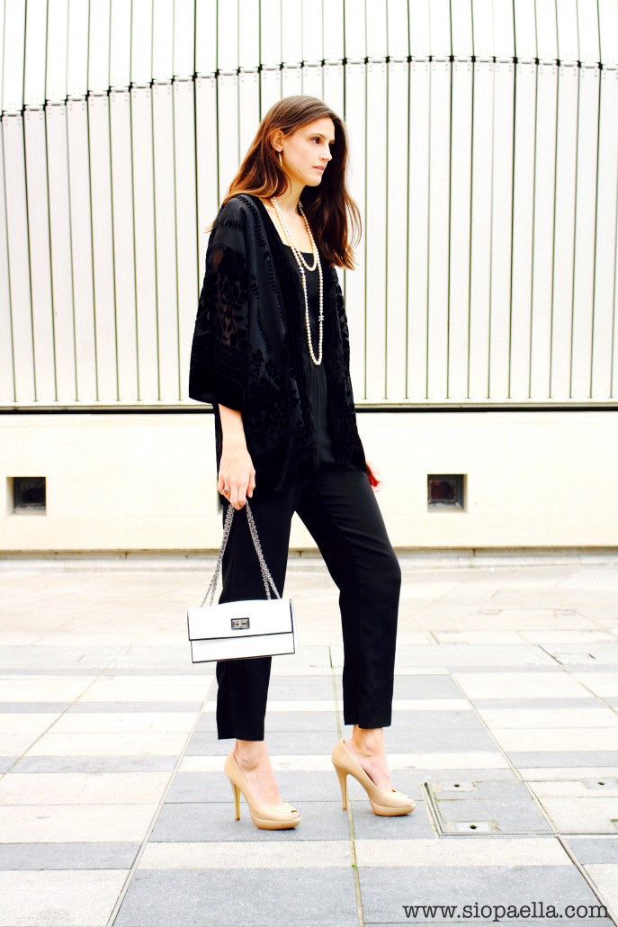 Anna wears Topshop black jumpsuit in a UK10 (Item Code- 688-54) and H&M black kimono Size O/S (Item Code- 988-759) styled with Chanel CC Logo pearl necklace and Chanel white leather shoulder bag.