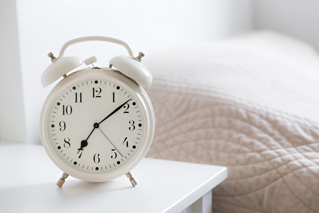 alarm clock on a bedside table