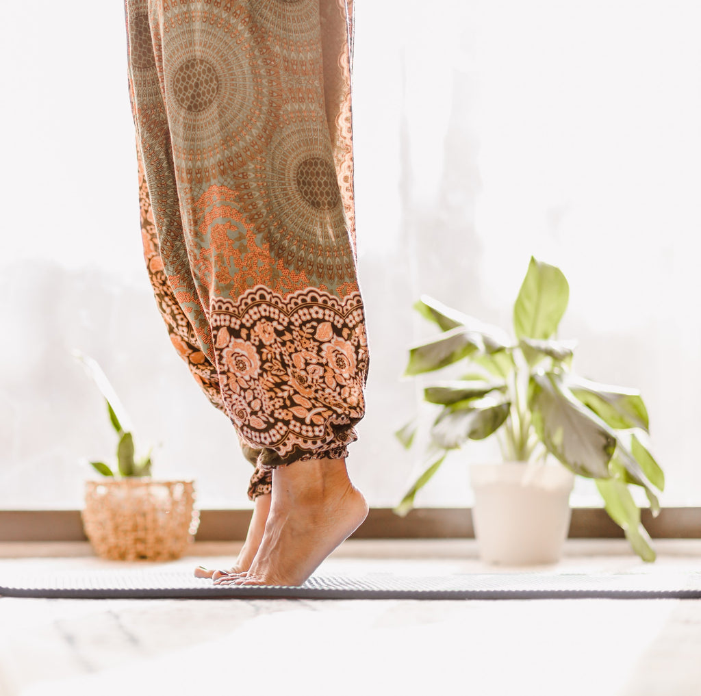 Woman rising on toes performing Yoga