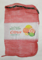 red mesh bag with label for oranges