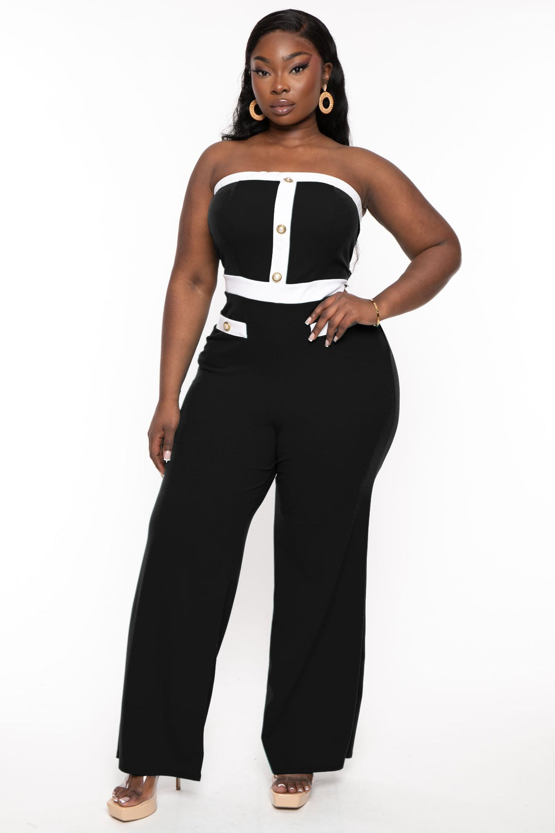 This plus size, stretch knit jumpsuit features an all over fishnet