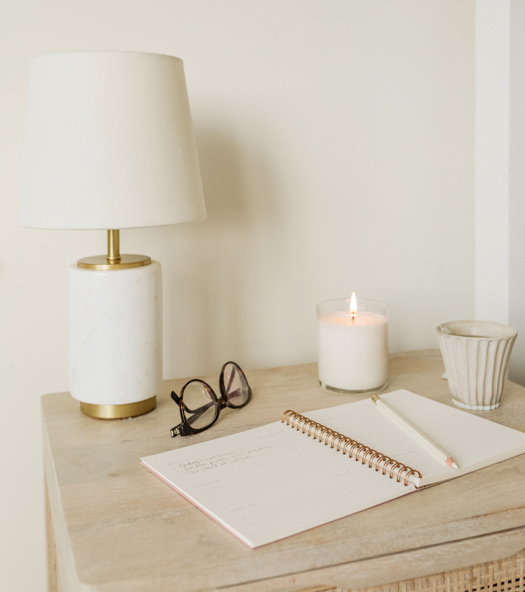 Mini Gratitude Journal on a bedside table