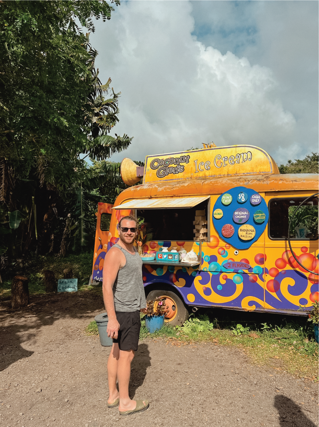 Adam, an owner of Hello Adorn standing in front of the coconut glen's ice cream truck in Maui, Hawaii.