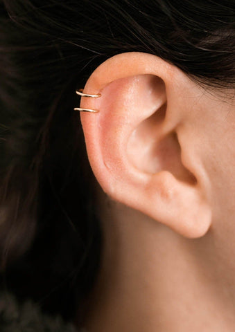 Hello Adorn's Double Up Ear Cuff earring placed high on the lobe as a cartilage piercing.