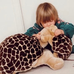 Baby kissing his cuddly toy my turtle Rosalie