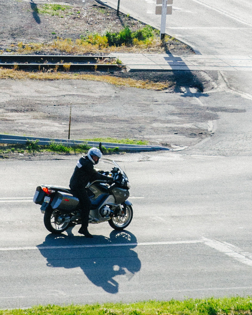 Dad on BMW motorcycle at stop light. 