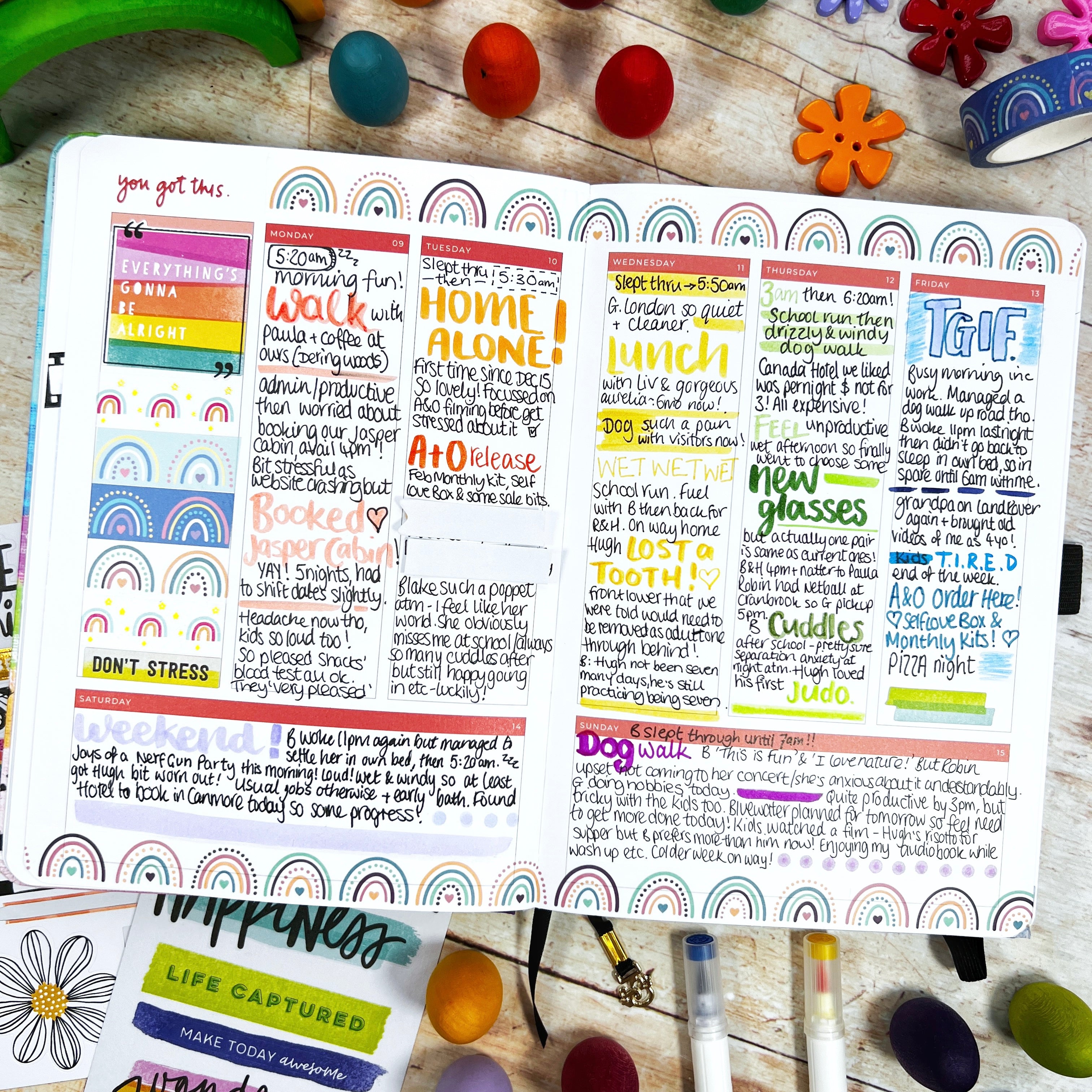Open planner with filled pages of writing and bright words