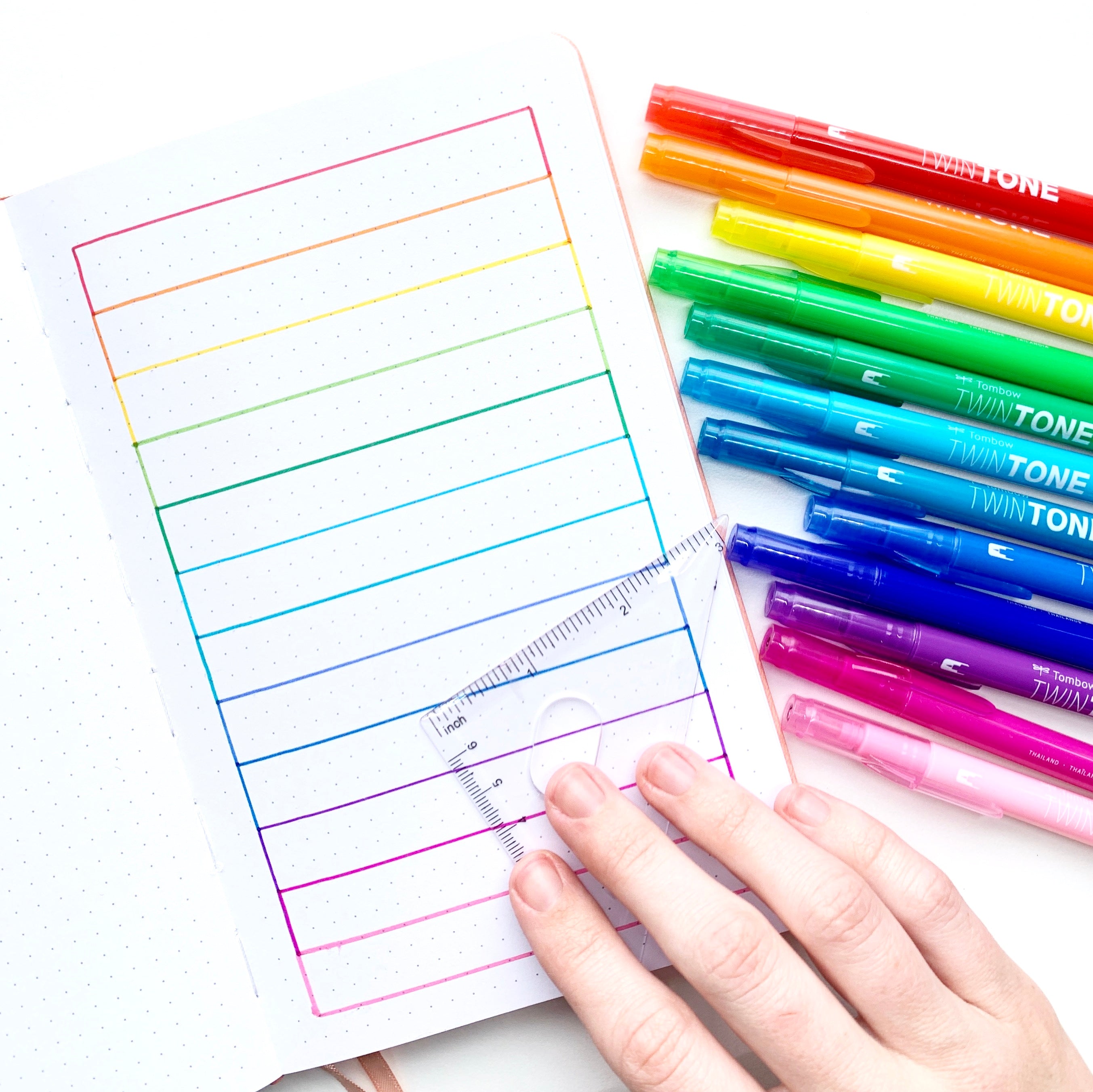 Learn how to create a rainbow pattern in your dot grid notebook with Adrienne from @studio80design