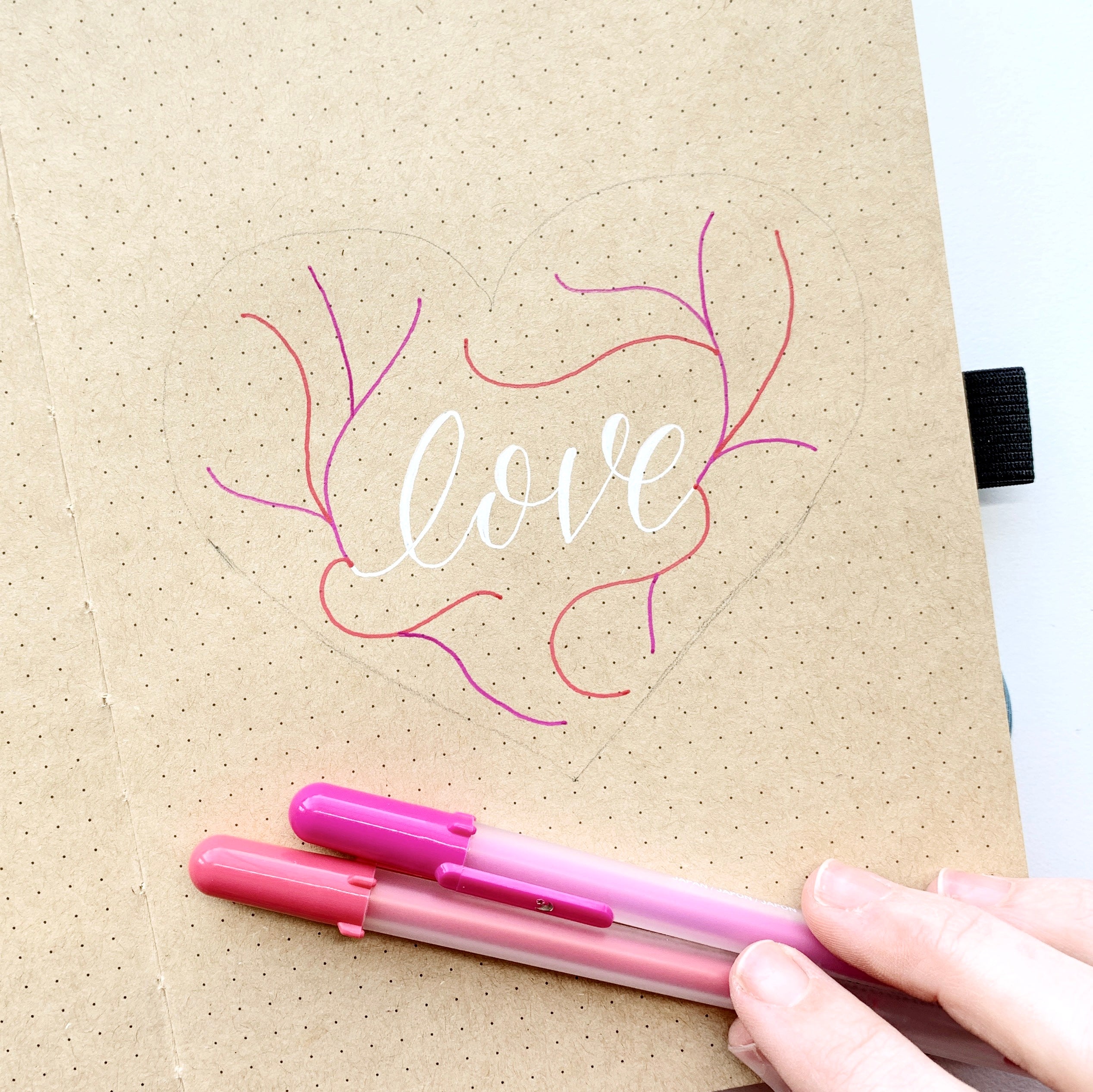 Learn how to create a floral heart illustration in the NEW Kraft Paper Dot Grid Notebook with Adrienne from @studio80design!