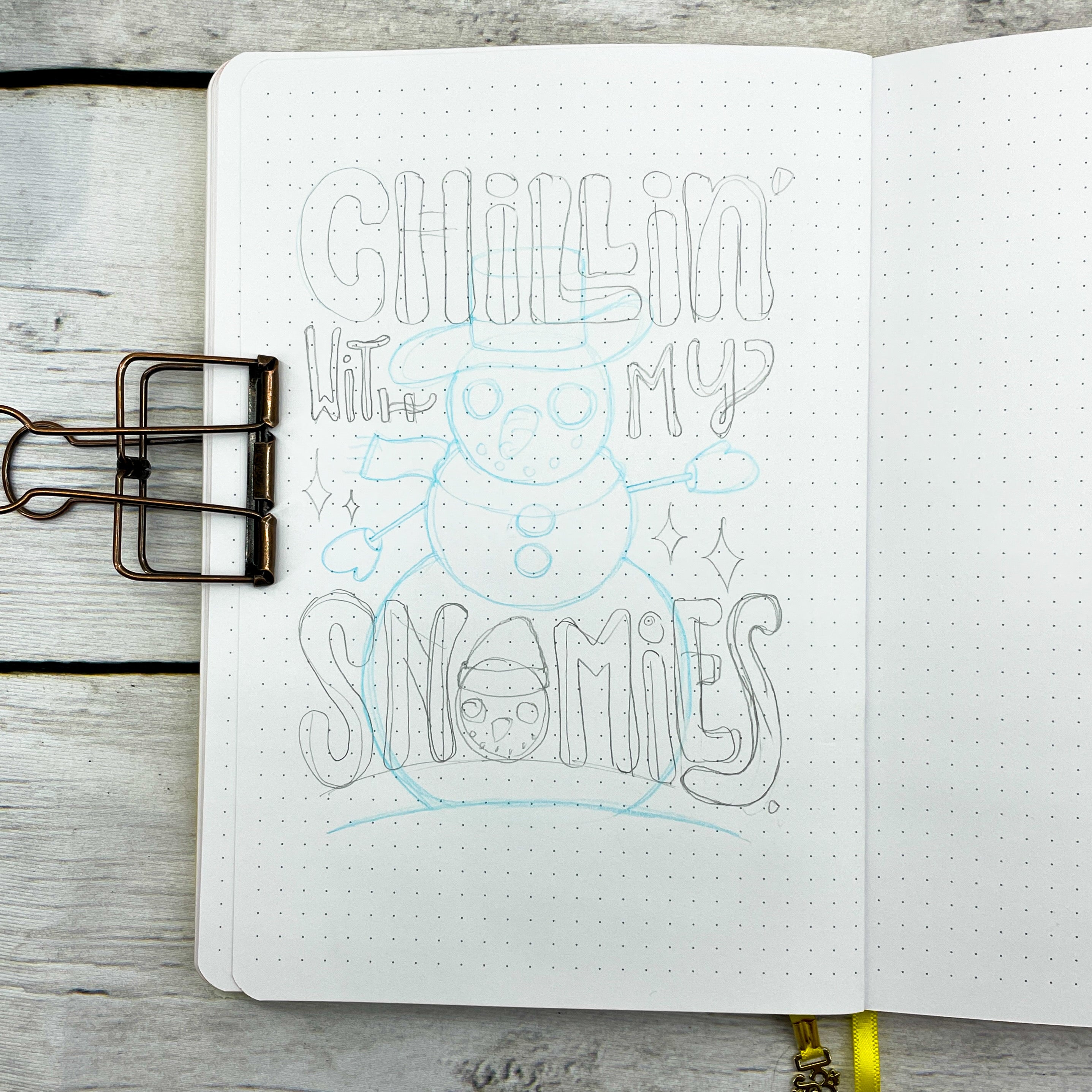 photo of sketch of blue snowman and the hand lettered quote "Chillin with my snowmies"