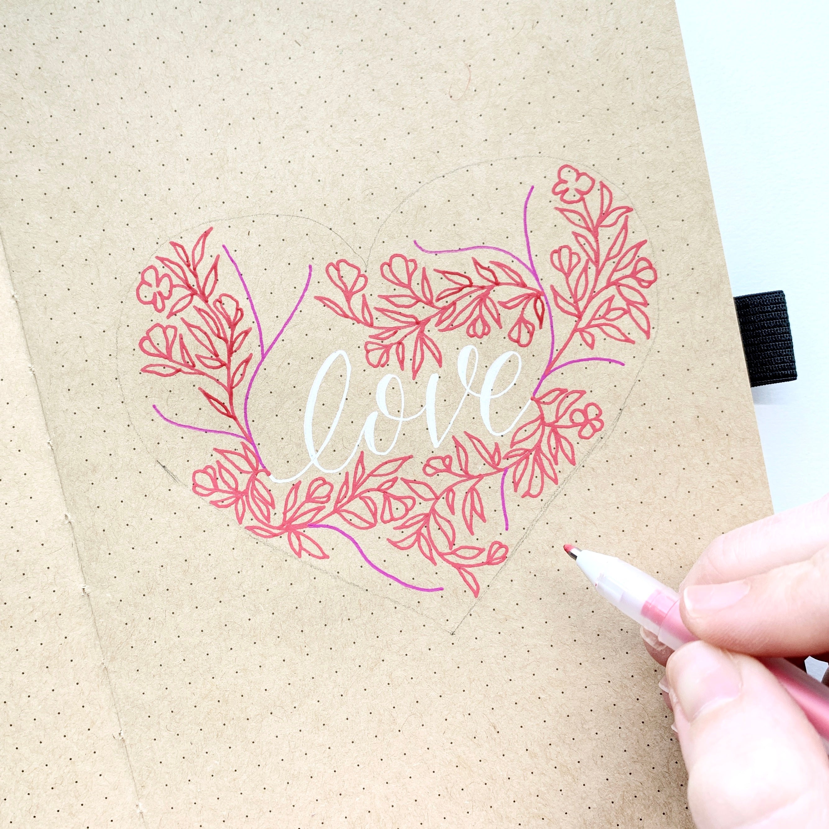 Learn how to create a floral heart illustration in the NEW Kraft Paper Dot Grid Notebook with Adrienne from @studio80design!