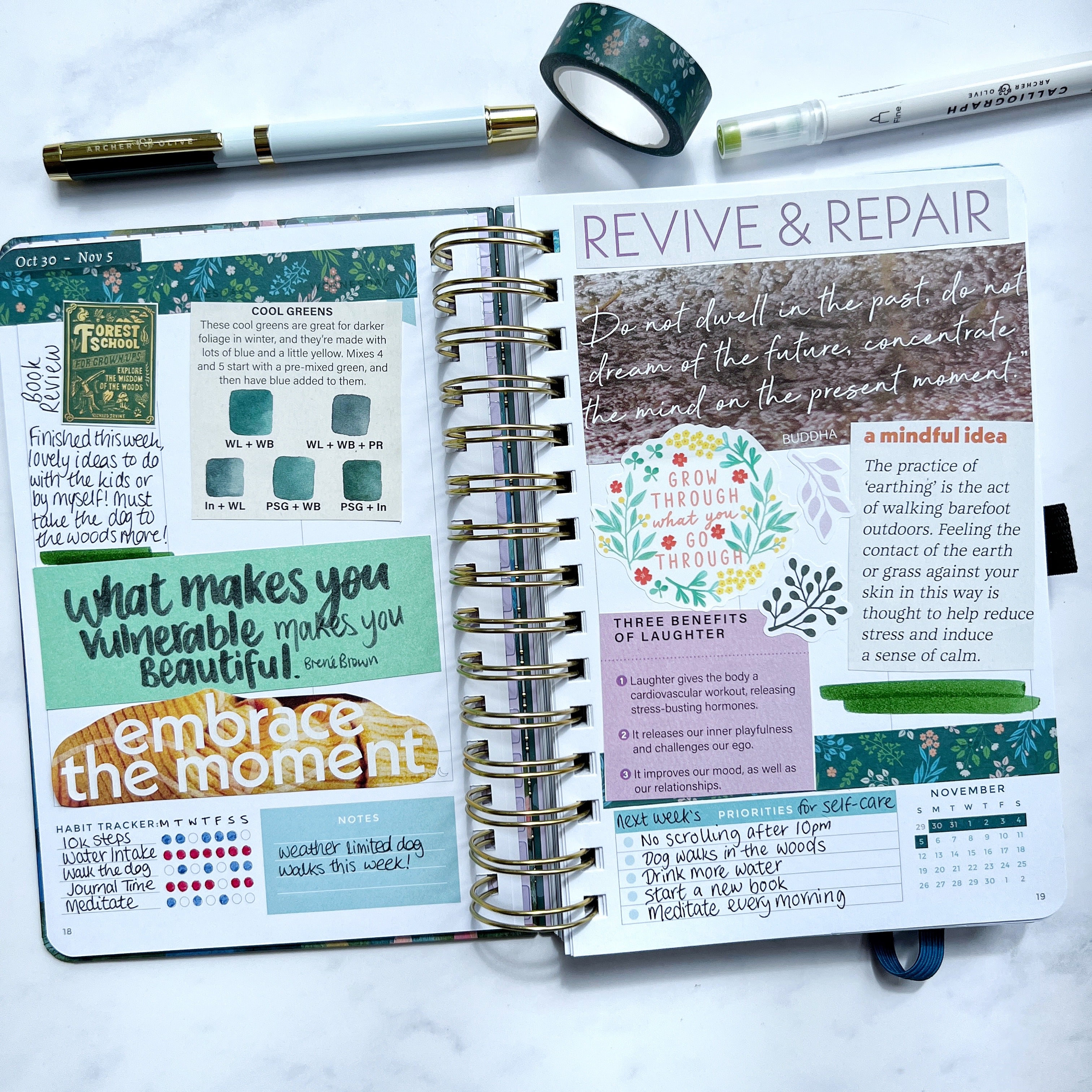 Open planner filled with quotes, magazine cuttings and stickers