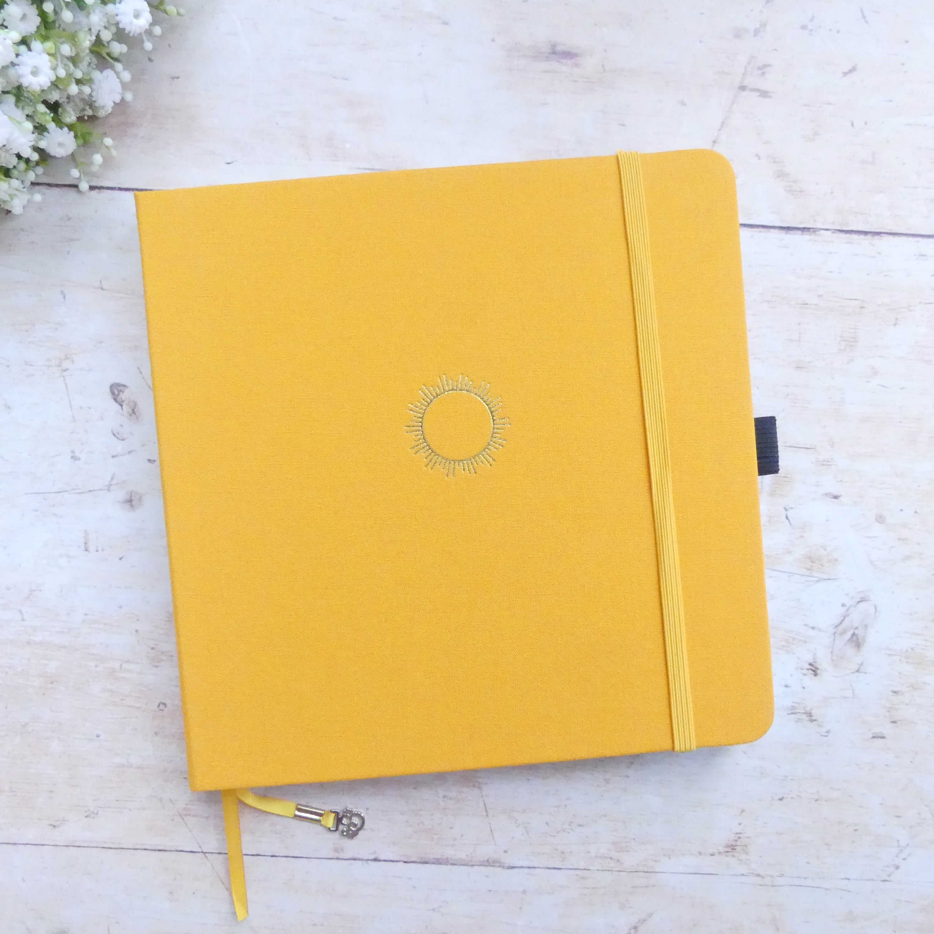 8x8 yellow journal with sun icon