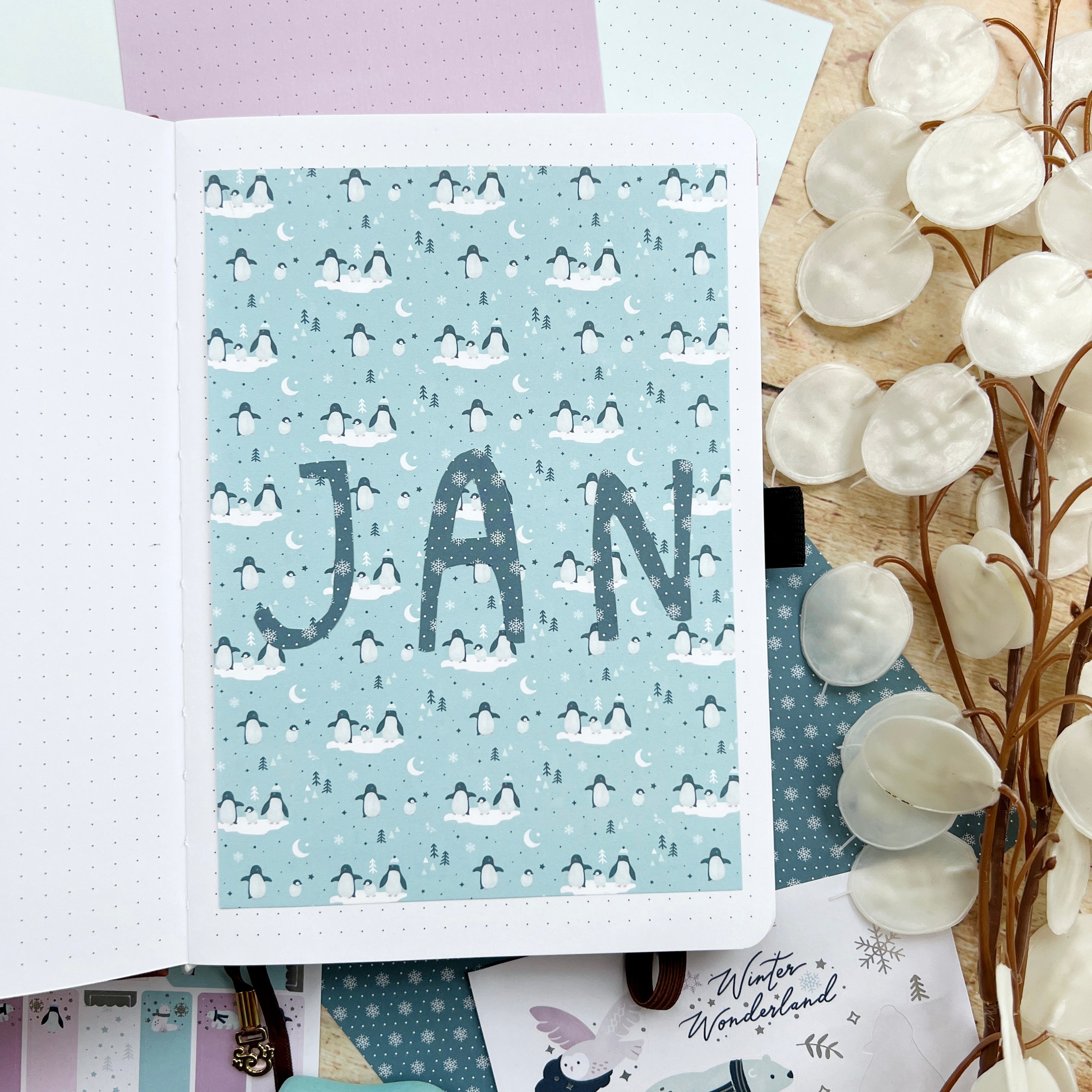 Open journal with letters cut from patterned paper