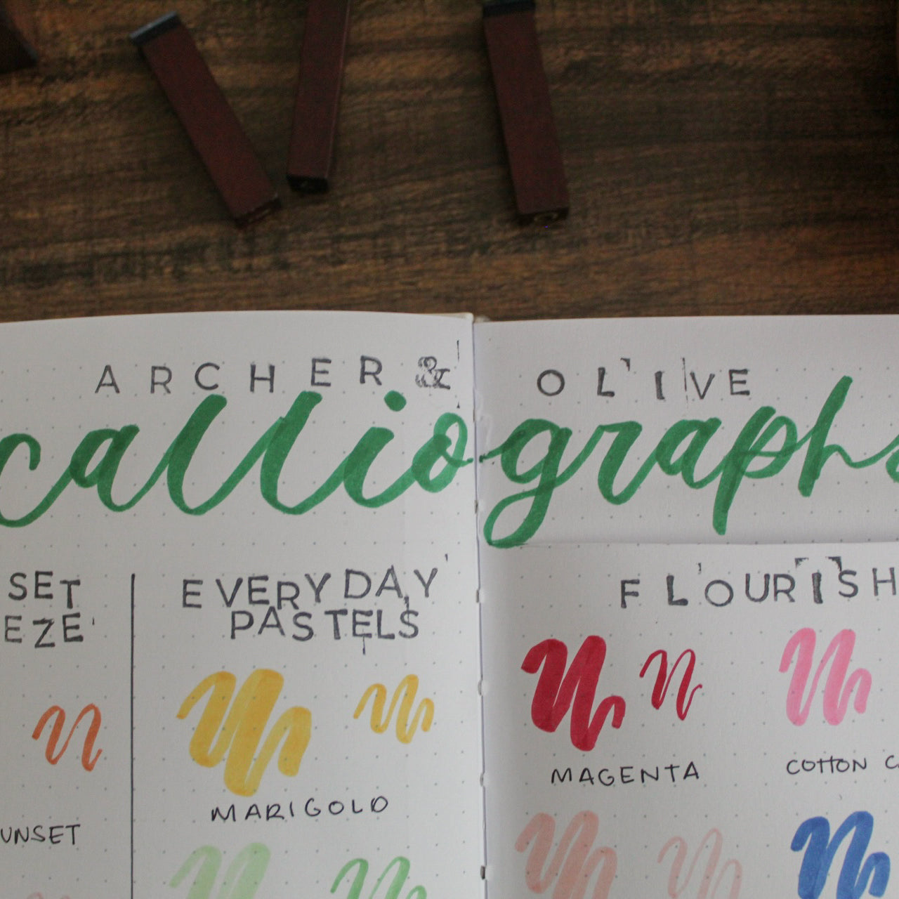 The words Archer and Olive are stamped at the top of a journal page. The word "calliographs" is written in calliography below it.