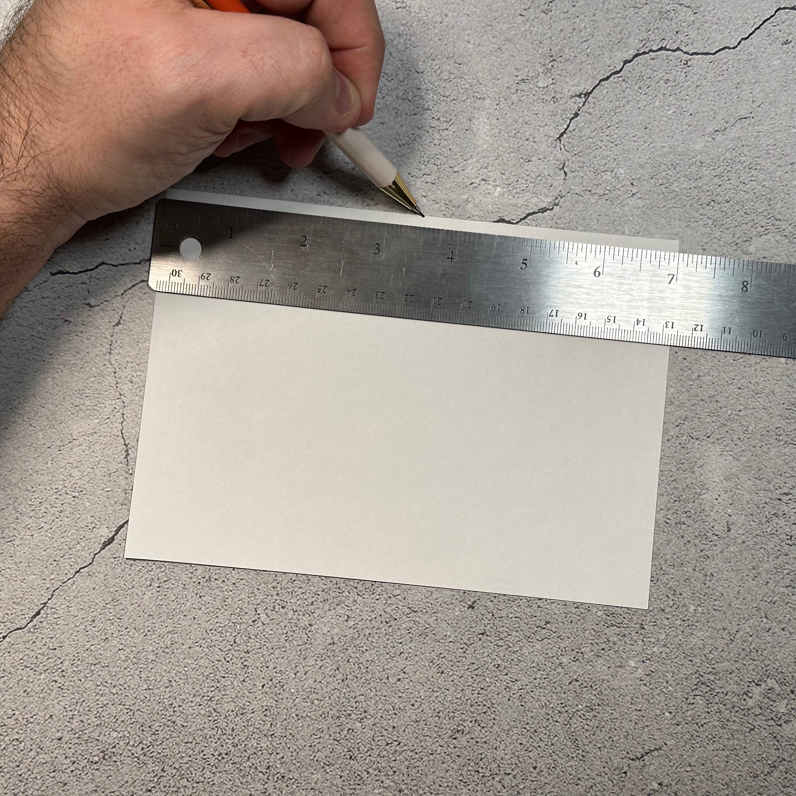 paper with a ruler marking middle