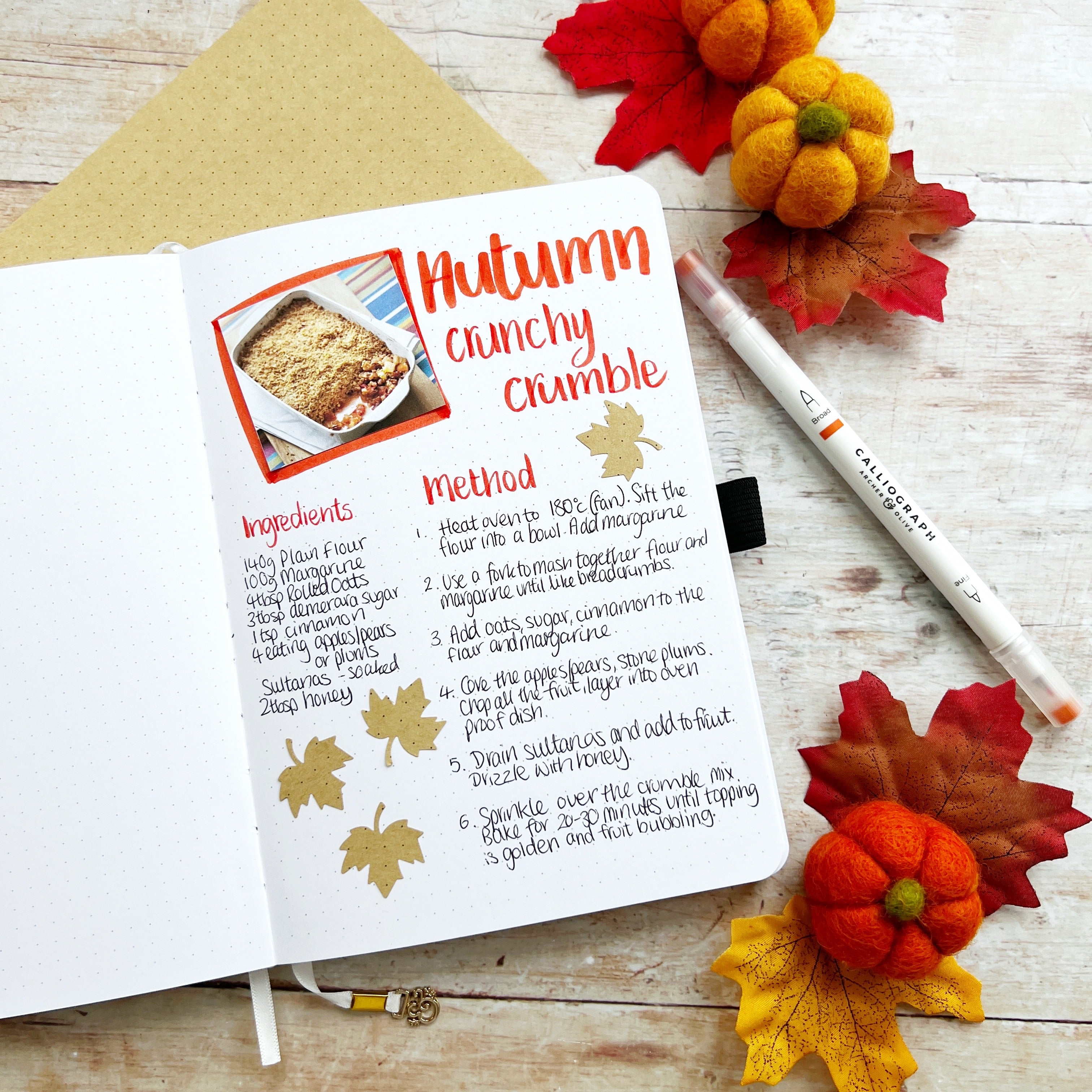 Open journal with autumn crumble recipe 
