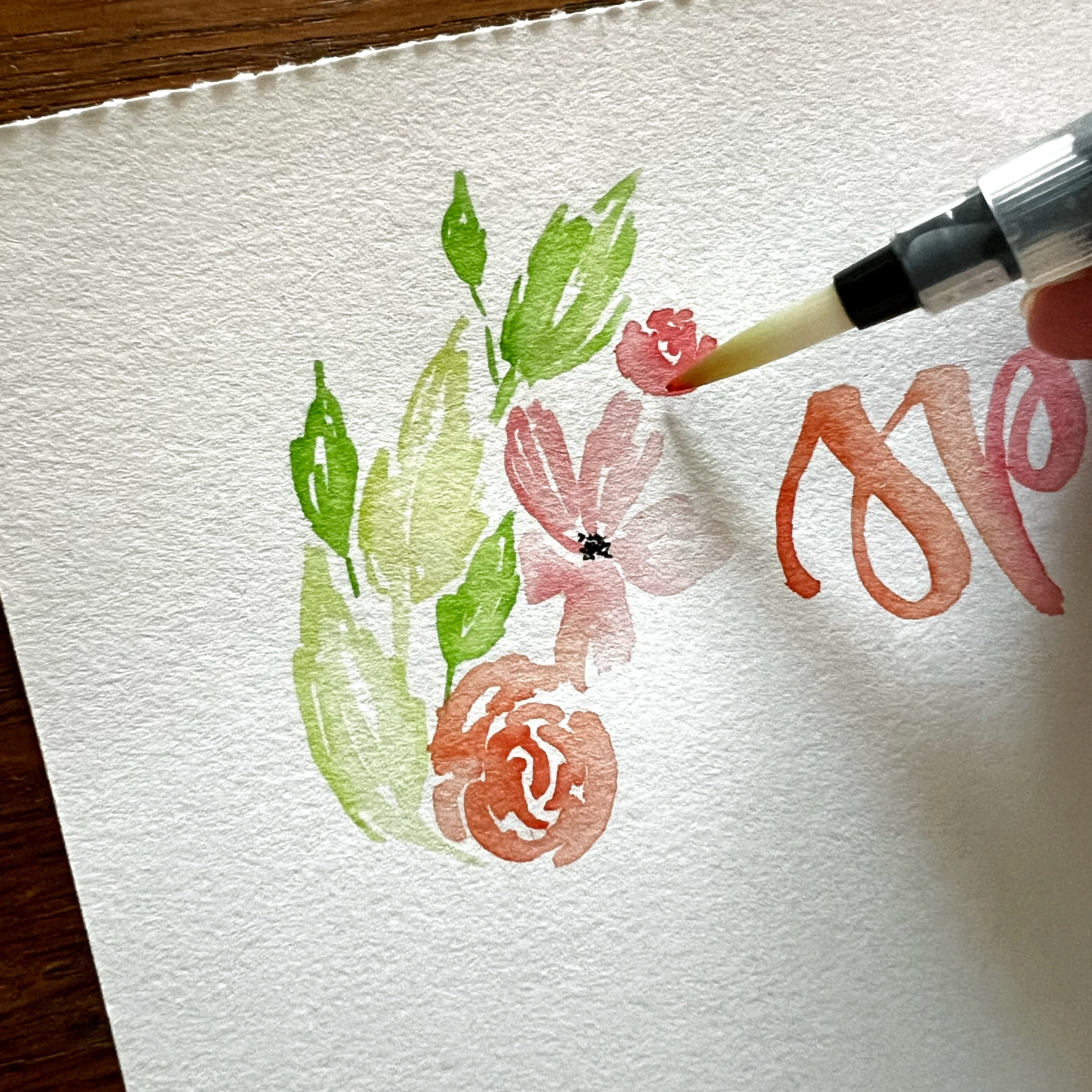 Photo of watercolor floral painting with water brush pen