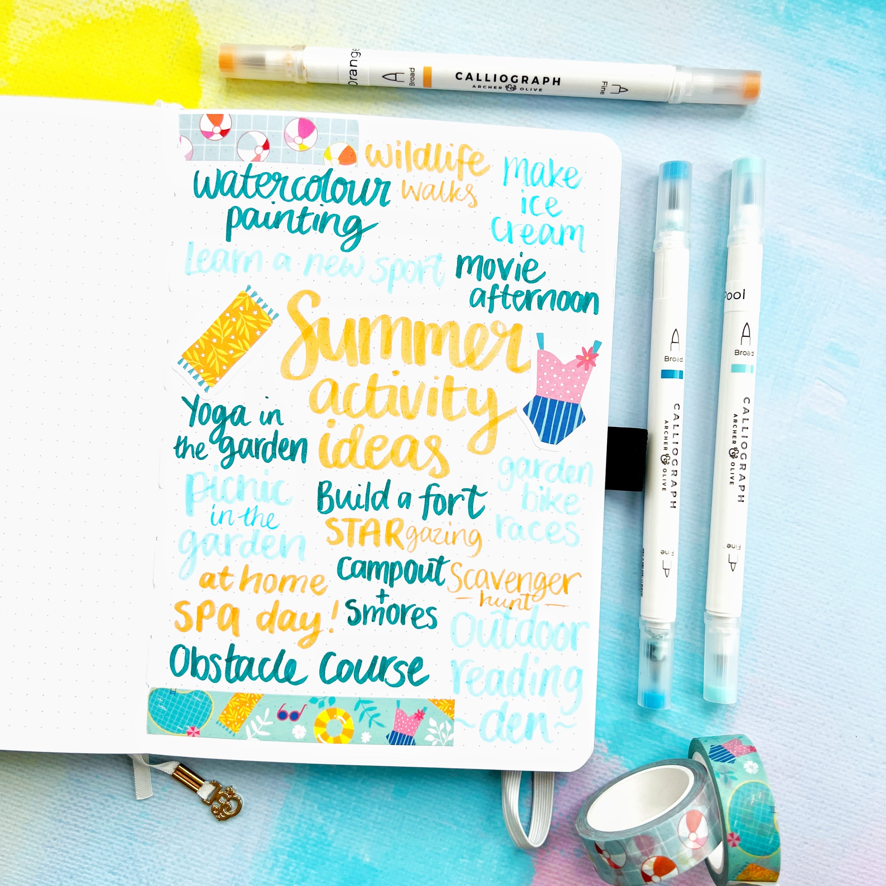 Completed page full of summer activity ideas with washi and stickers