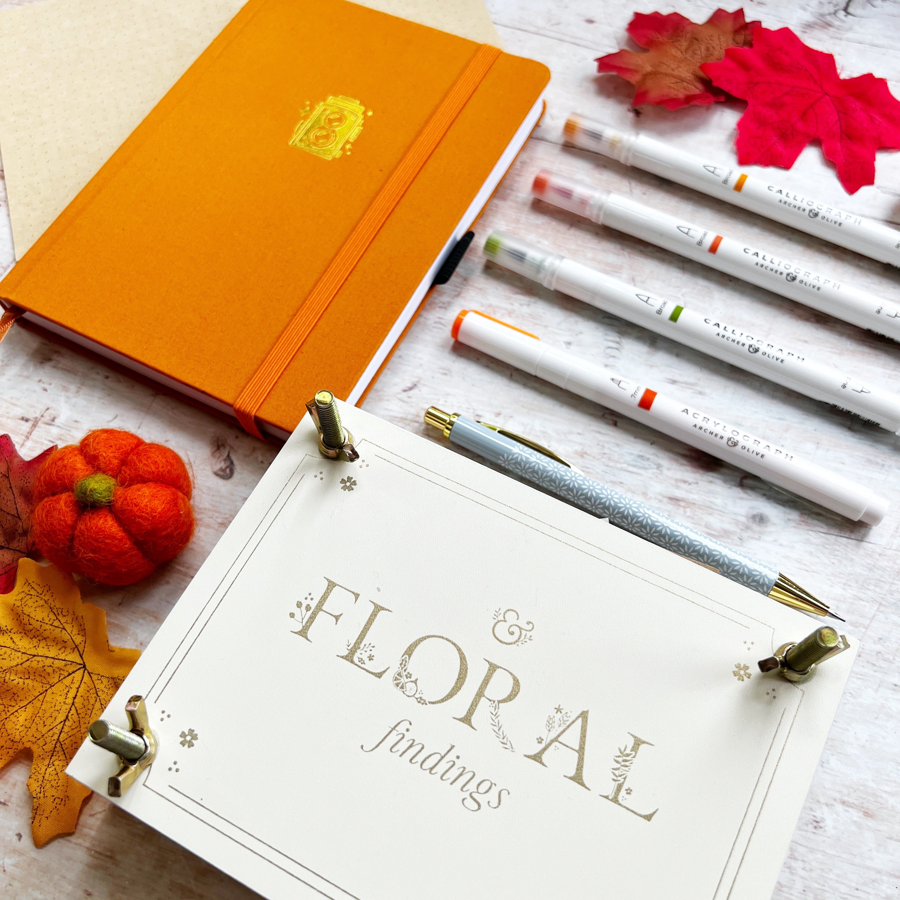 Orange journal flower press and pens