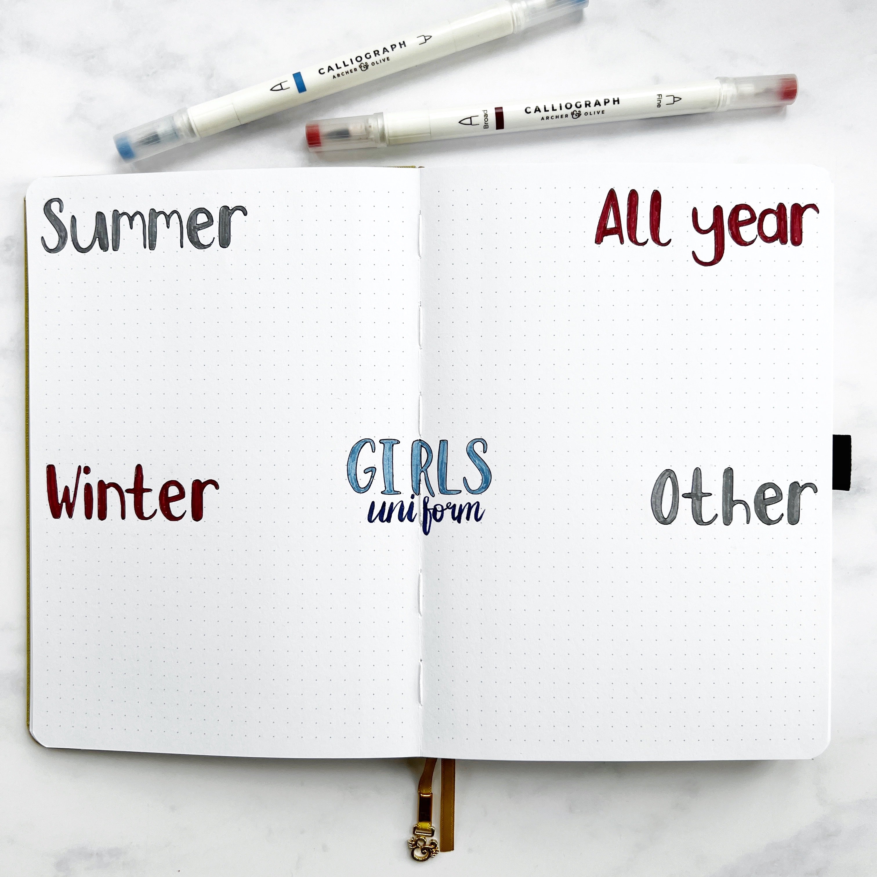 Open journal with headers uniform, summer, winter, all year