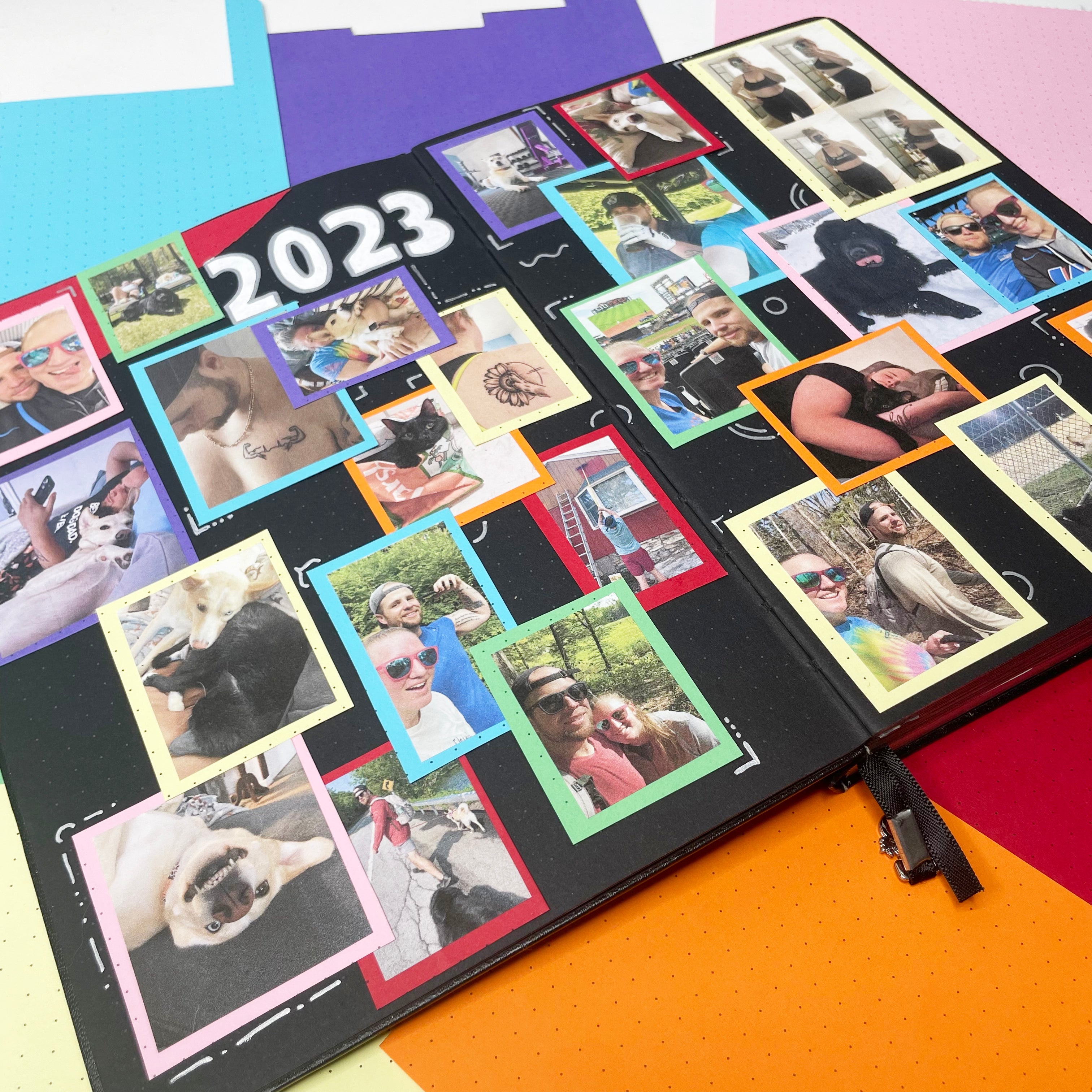 Memory page with rainbow frames and photos in a blackout notebook