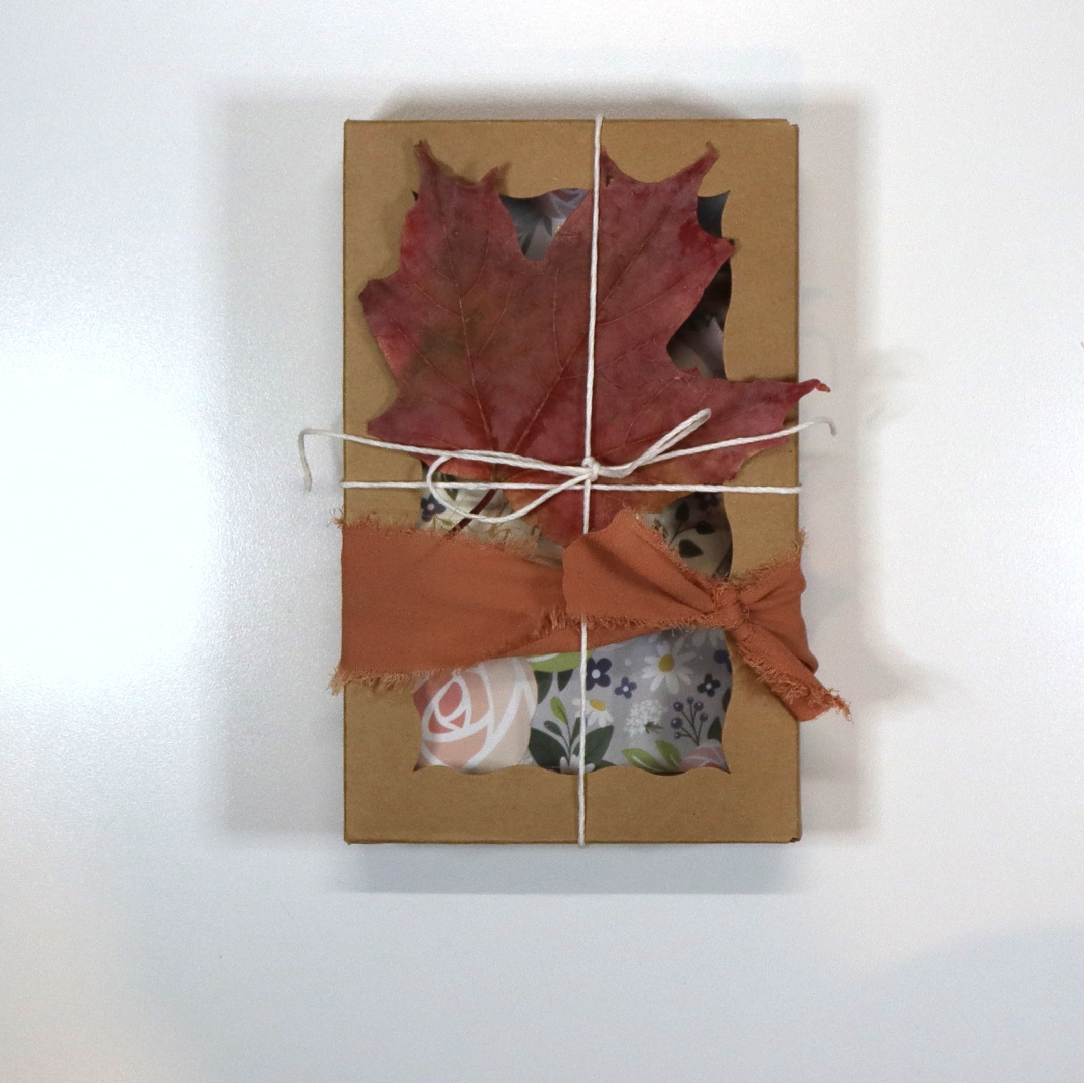 Kraft box and dried leaves gift wrapping