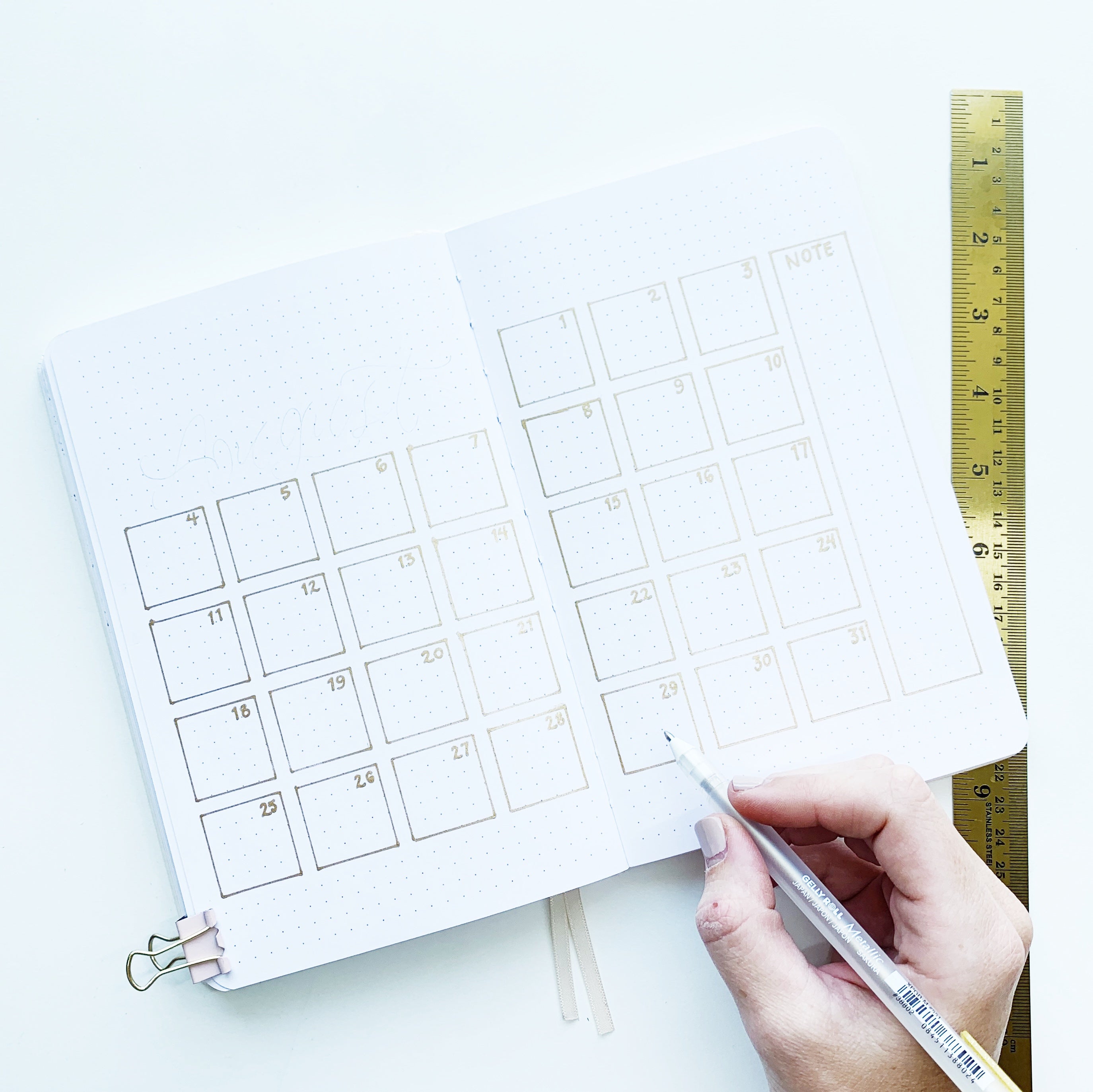 Learn how to create an all gold monthly bullet journal spread with Adrienne from @studio80design!