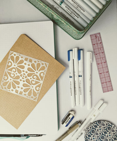 pens, notebook, and stencils supplies
