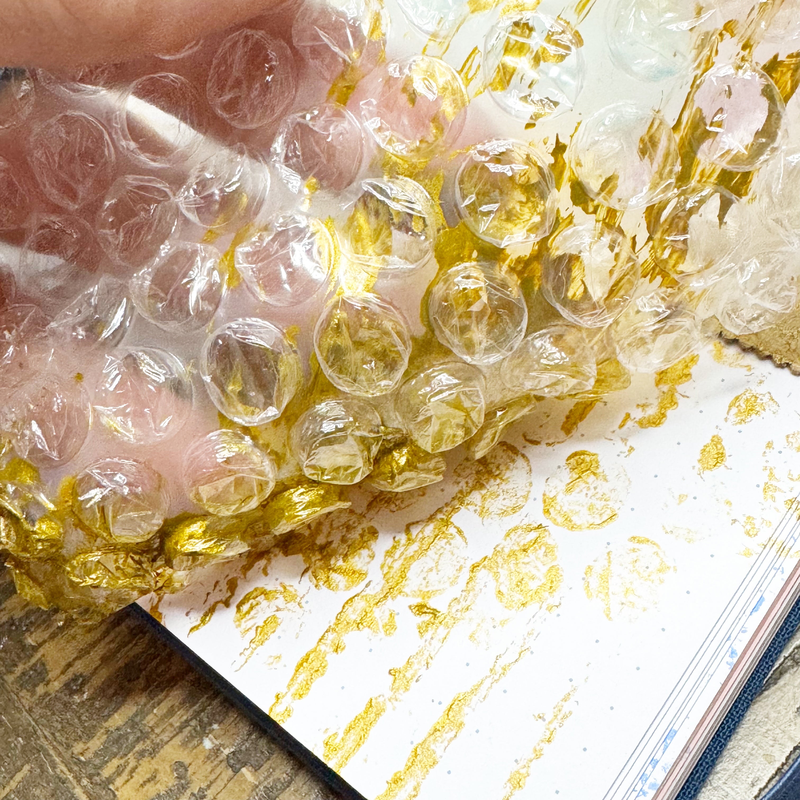 bubble wrap painting in a journal