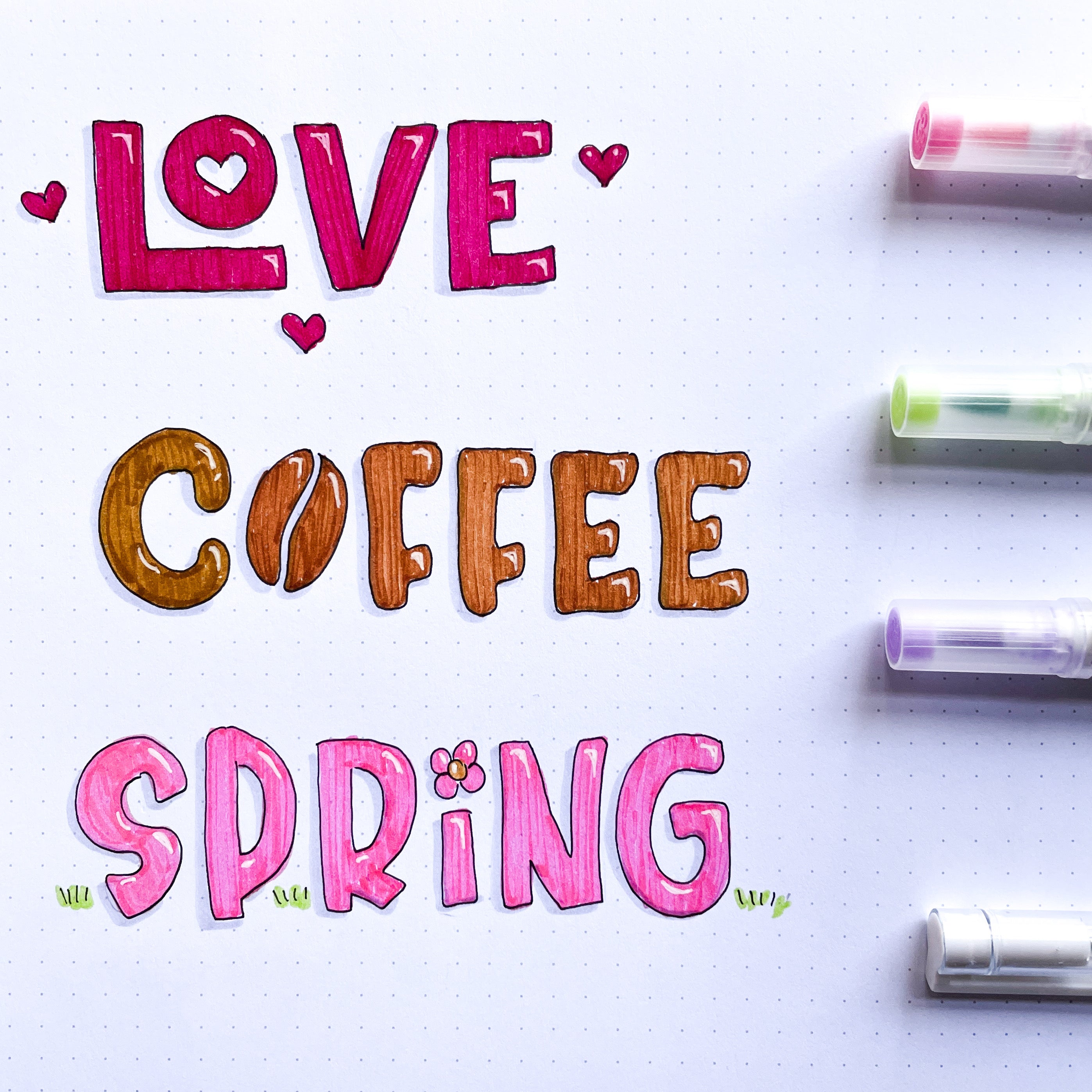 image of hand lettered words love, coffee, and spring on dot grid paper and calliograph brush pens