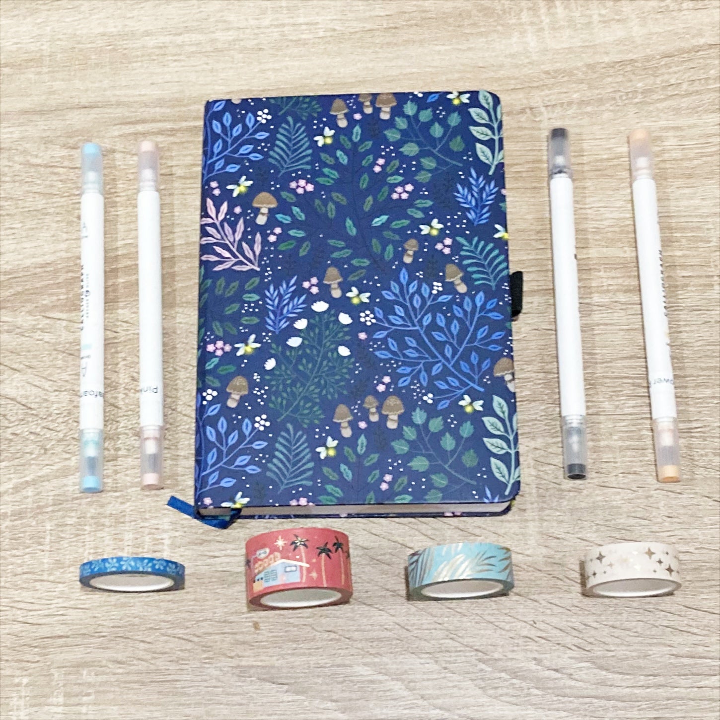 Supplies for project - notebook, calliographs, and washi tape