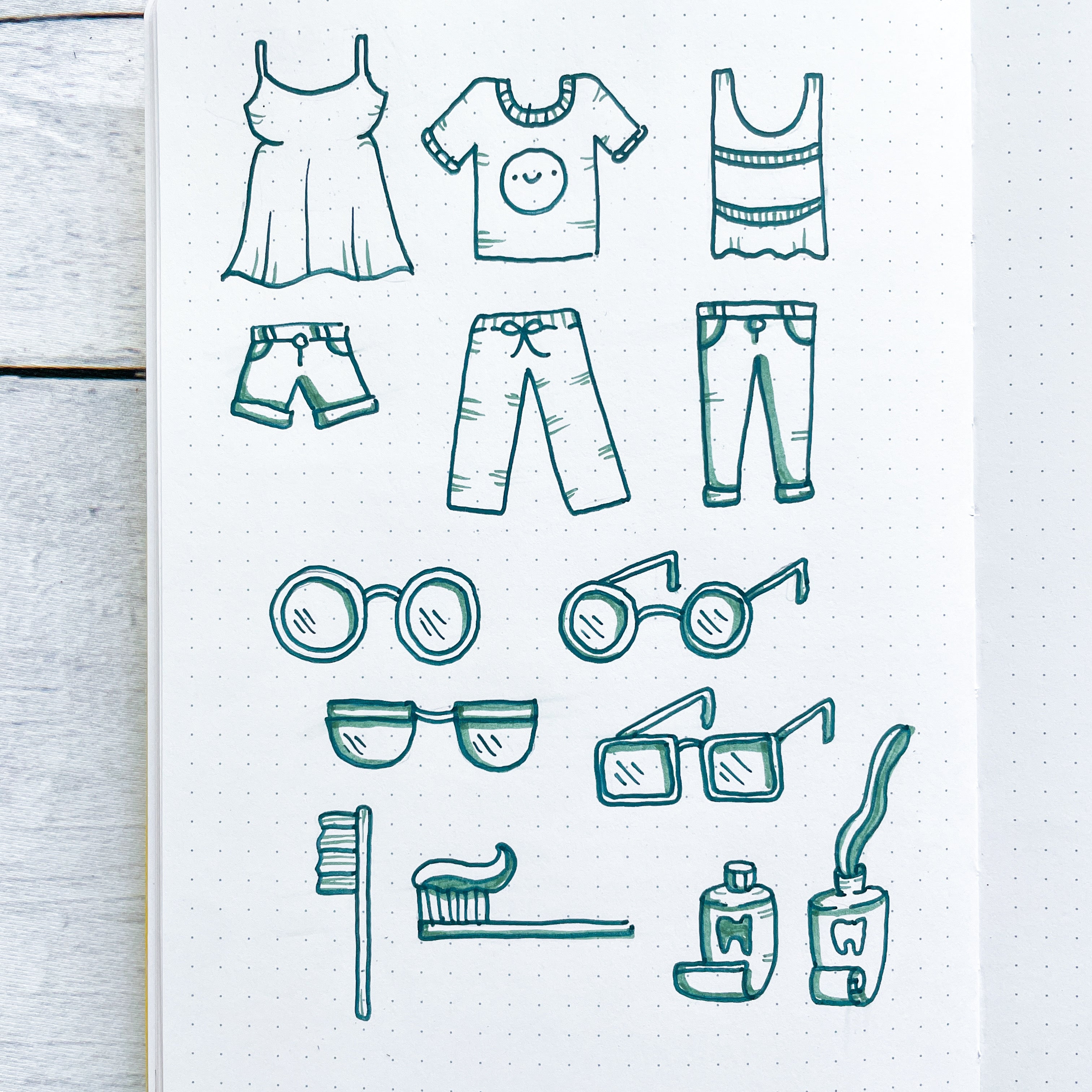 doodles of clothing, glasses, toothbrush and tooth paste