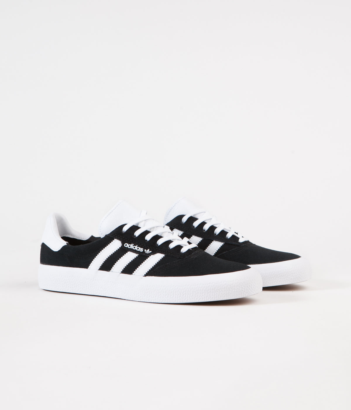 black adidas sneakers with white stripes