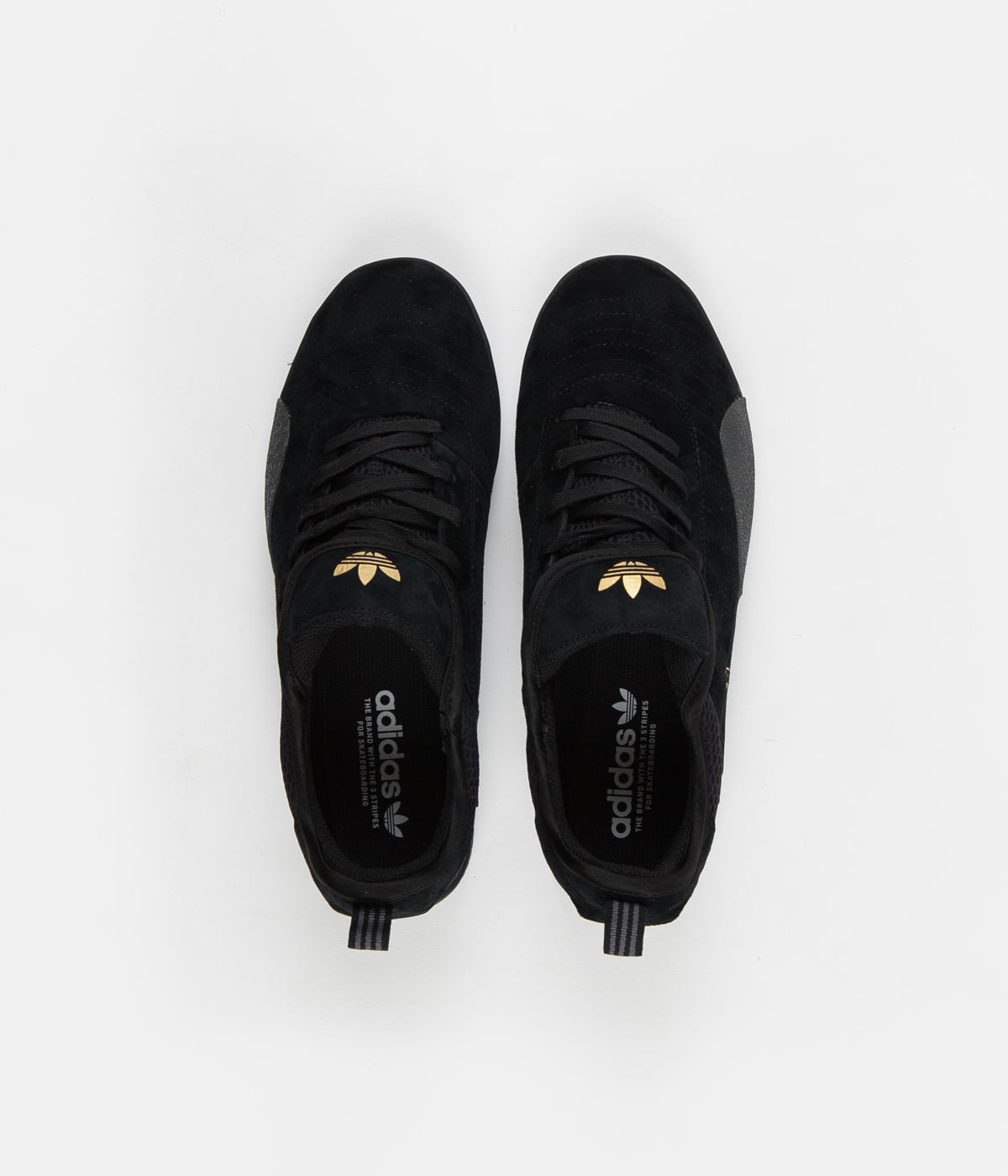 adidas black shoes with gold stripes