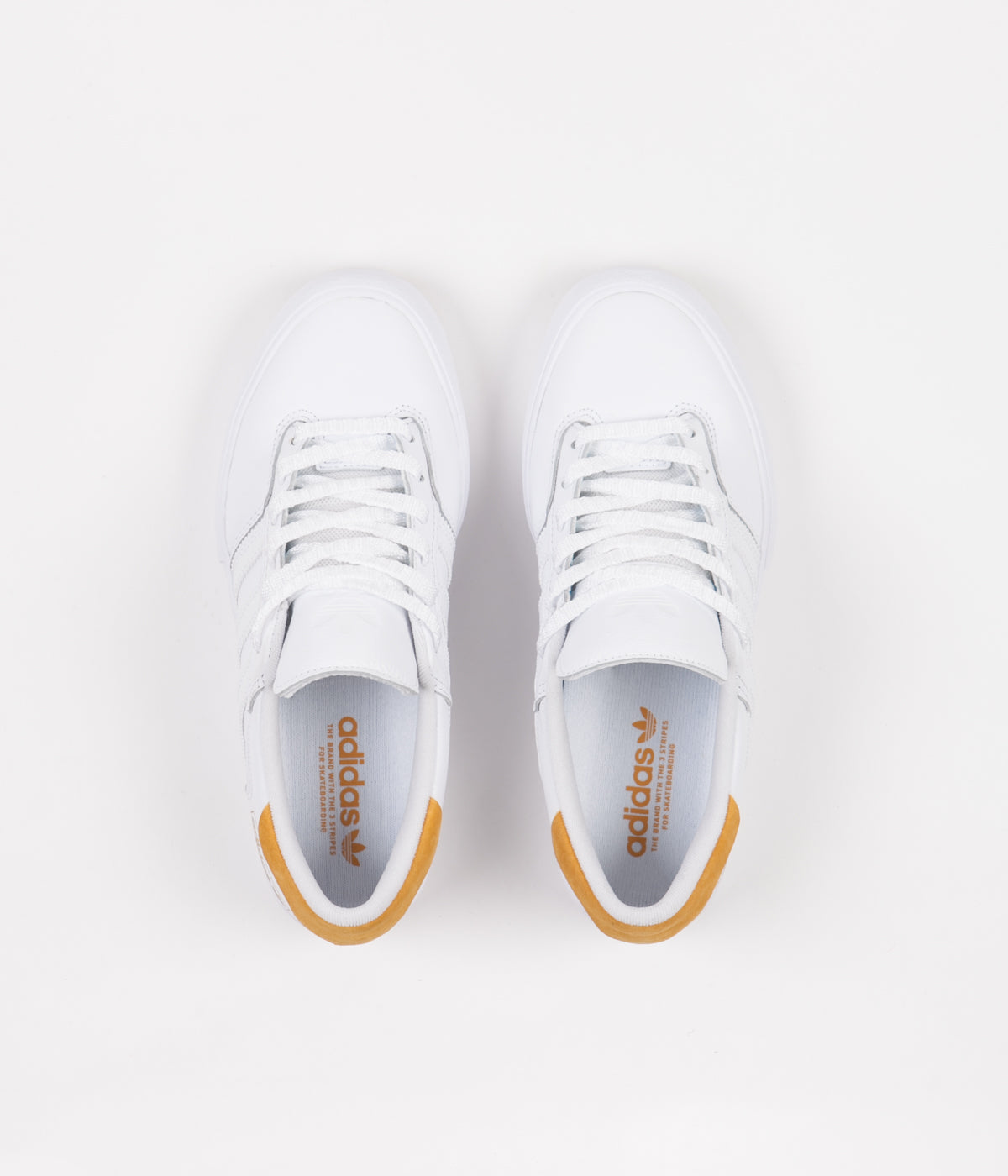 white and yellow adidas shoes