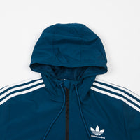 blue and black adidas windbreaker