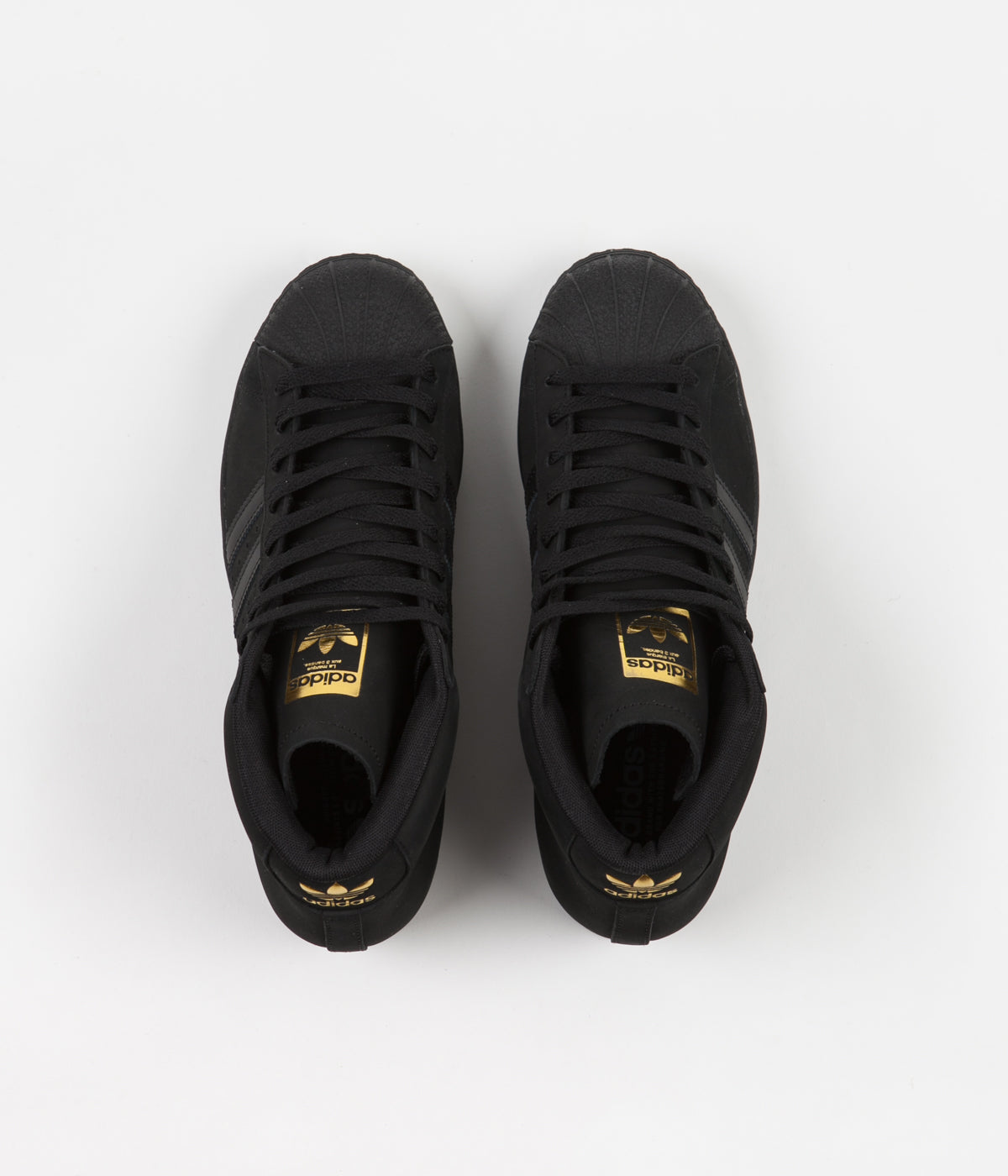 black adidas shoes with gold