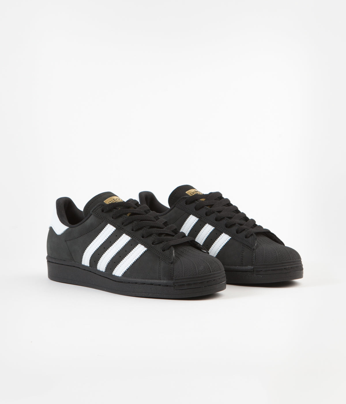 black adidas shoes with gold