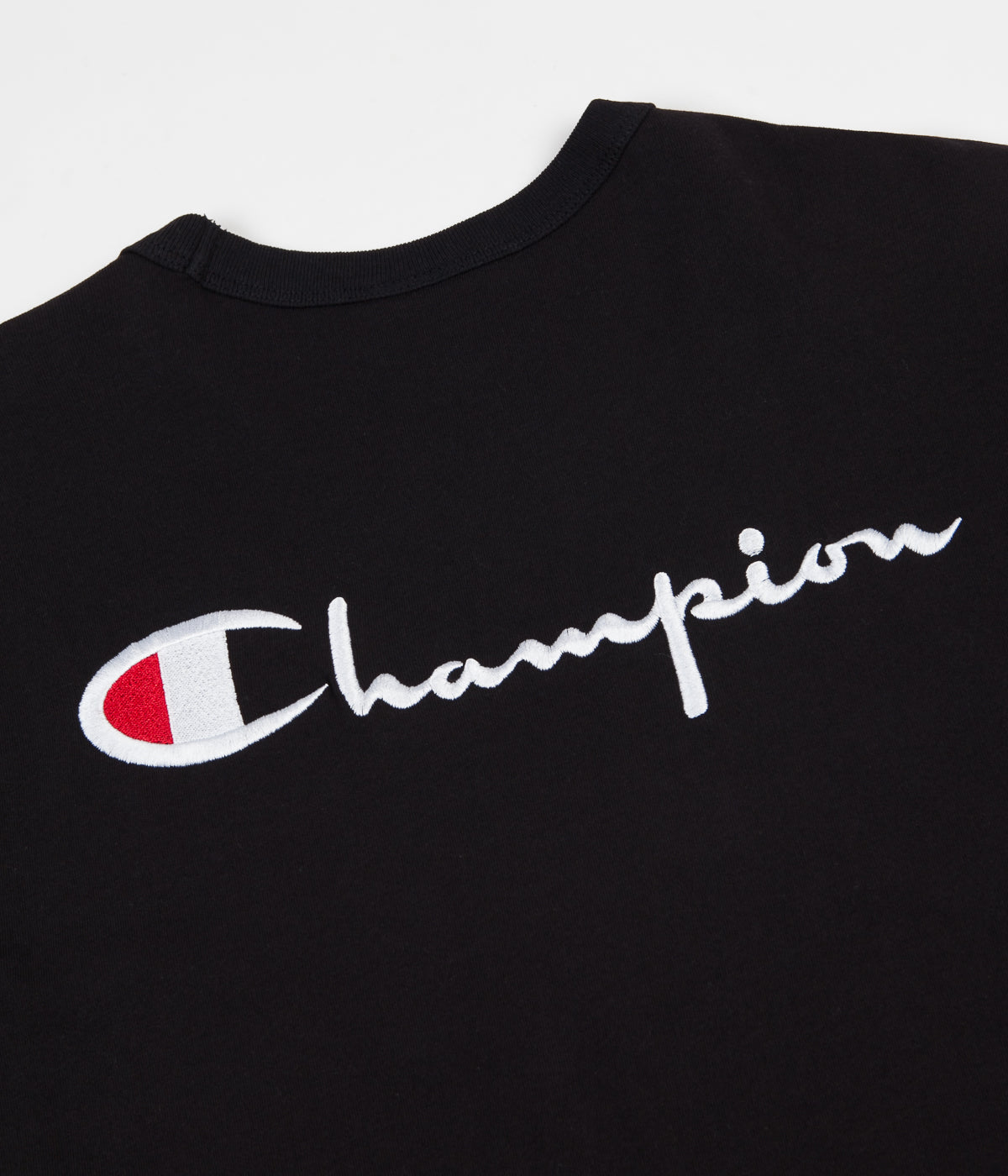 white and black champion shirt