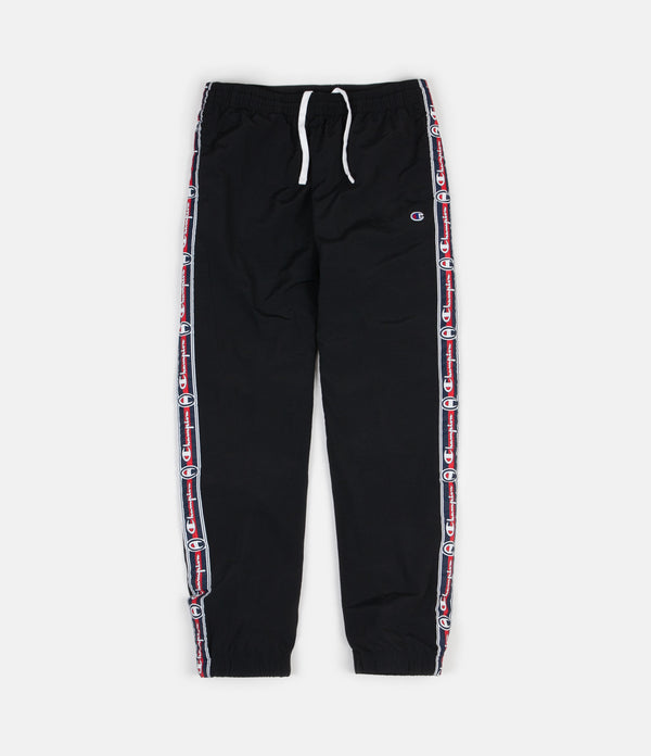 champion tracksuit bottoms with logo taping