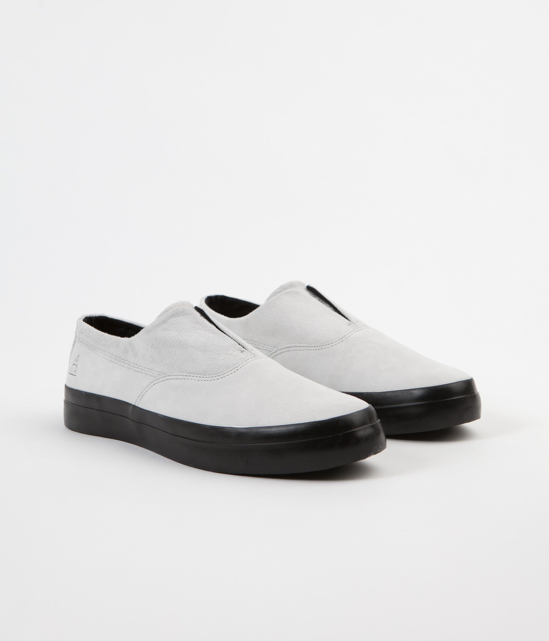 black slip on shoes with white soles